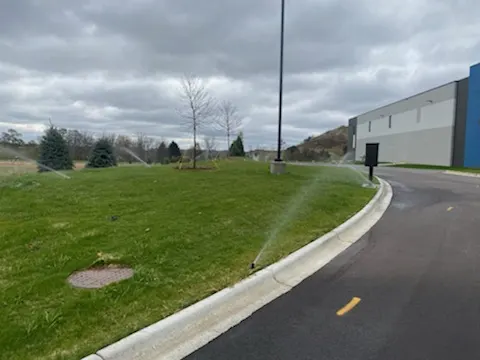 Sprinklers along a curved commercial drive